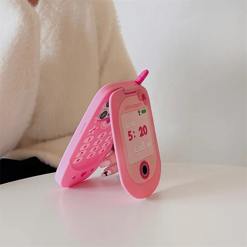 Light pink silicone flip phone case for iPhone with a built-in mirror on the front.