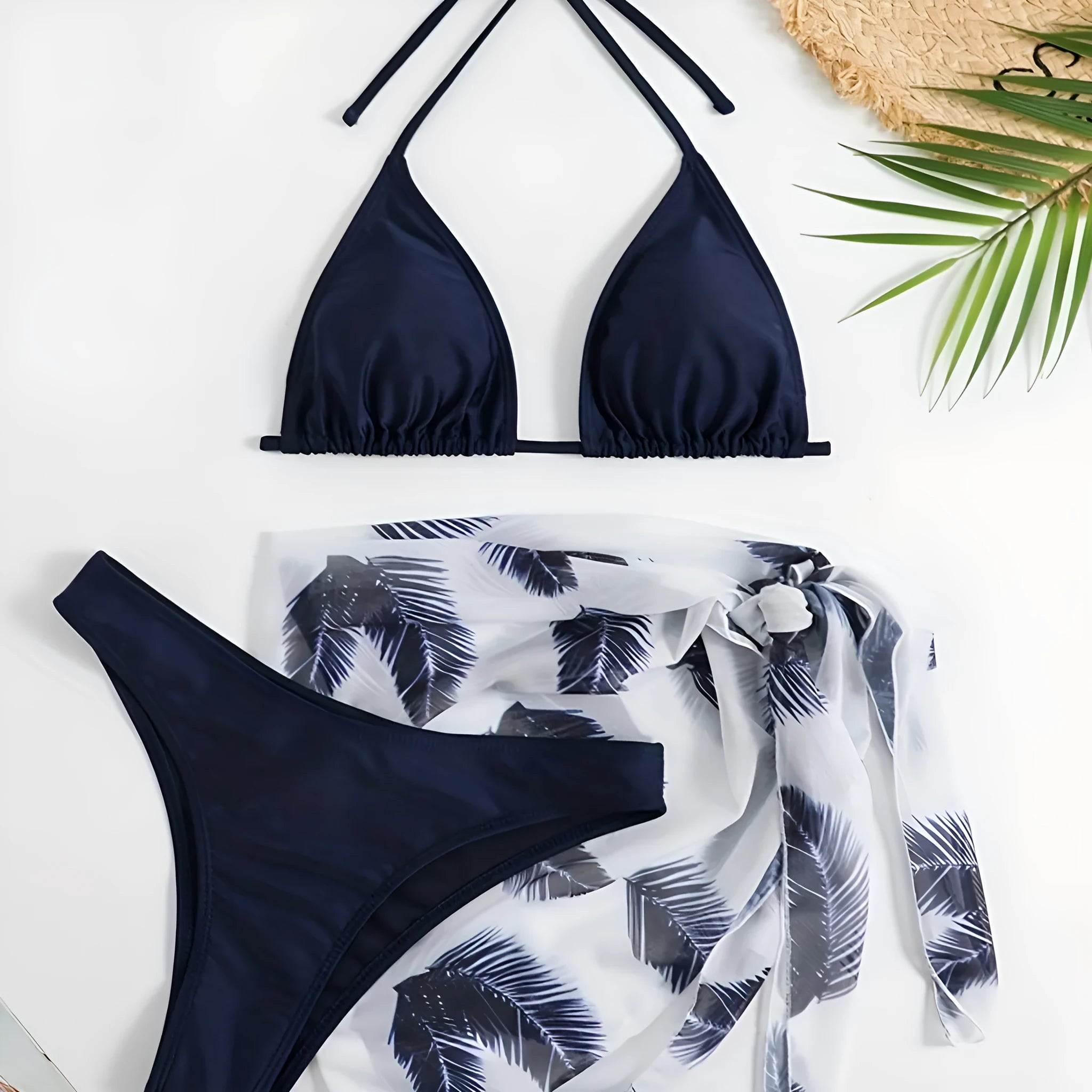 Three-piece bikini swimsuit set with printed gauze skirt in solid colour polyester, available in eight colours sizes XS to XL