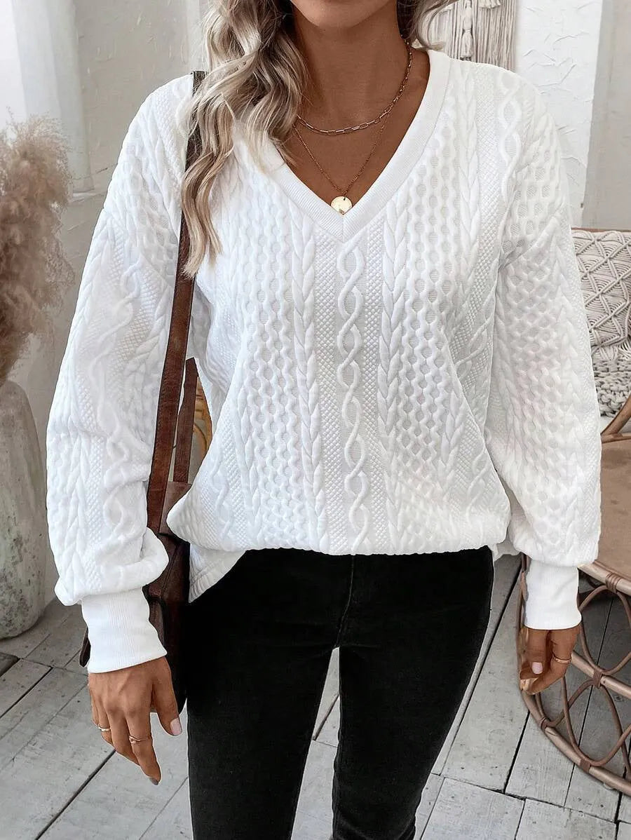 Milk white loose fit long sleeve t-shirt with a subtle 3D pattern on a casual model
