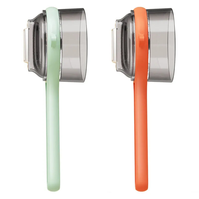 Kitchen multi-functional peeler with bucket storage in light green plastic on a clean countertop