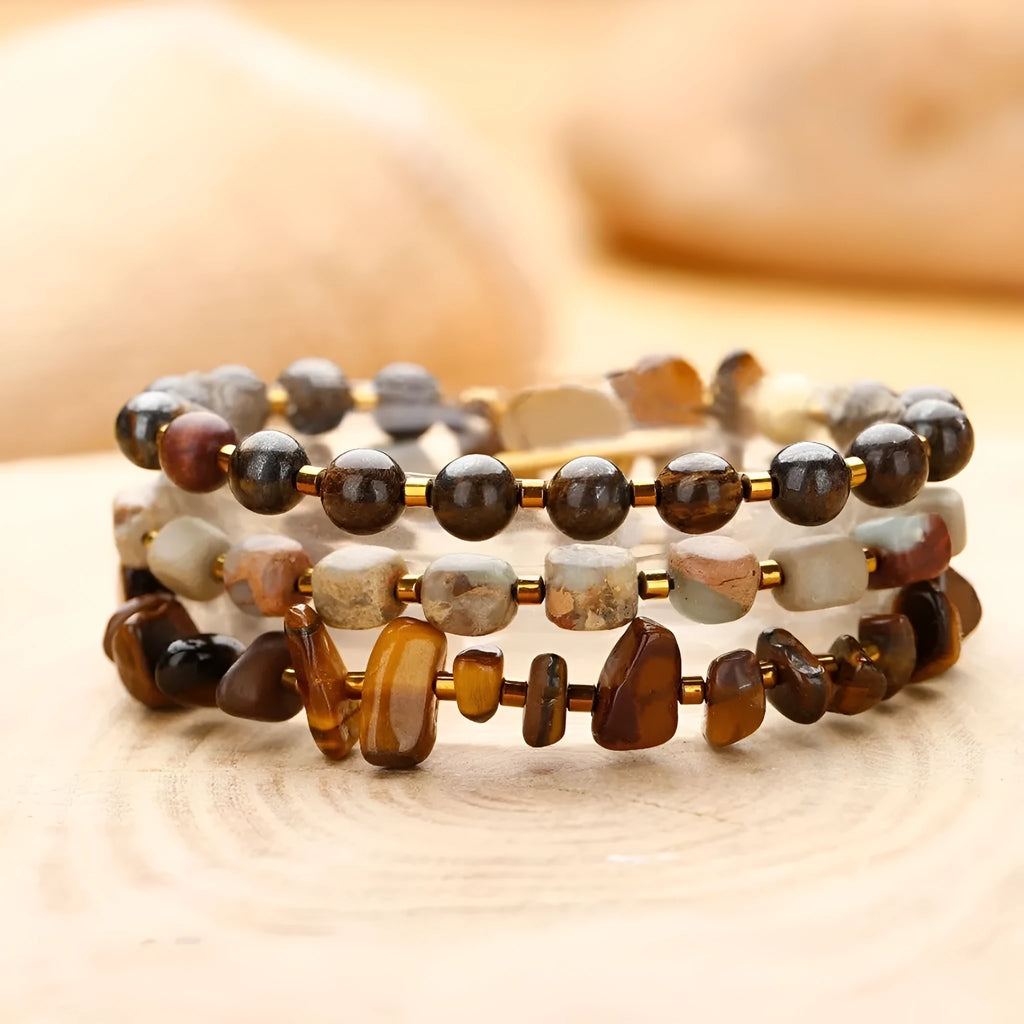 Tigereye Gravel Bronze Glow Ball Bracelet on brown background, handmade geometric texture