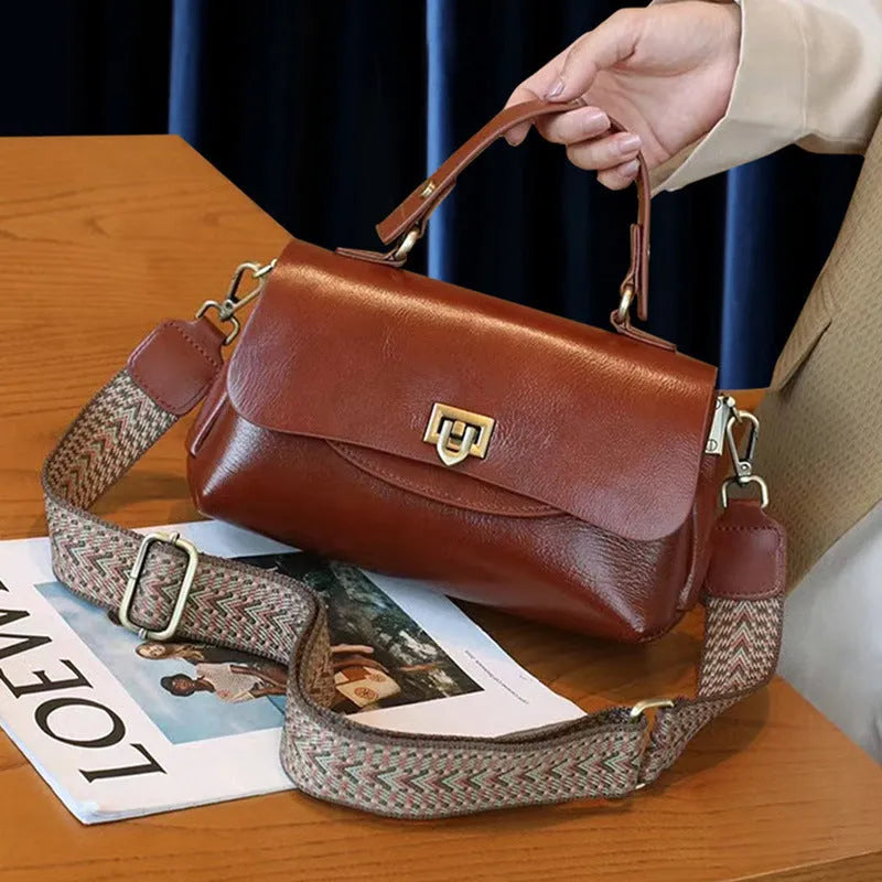 Women's retro genuine leather handbag in saddle shape, first layer cowhide, five colours including dark brown and black