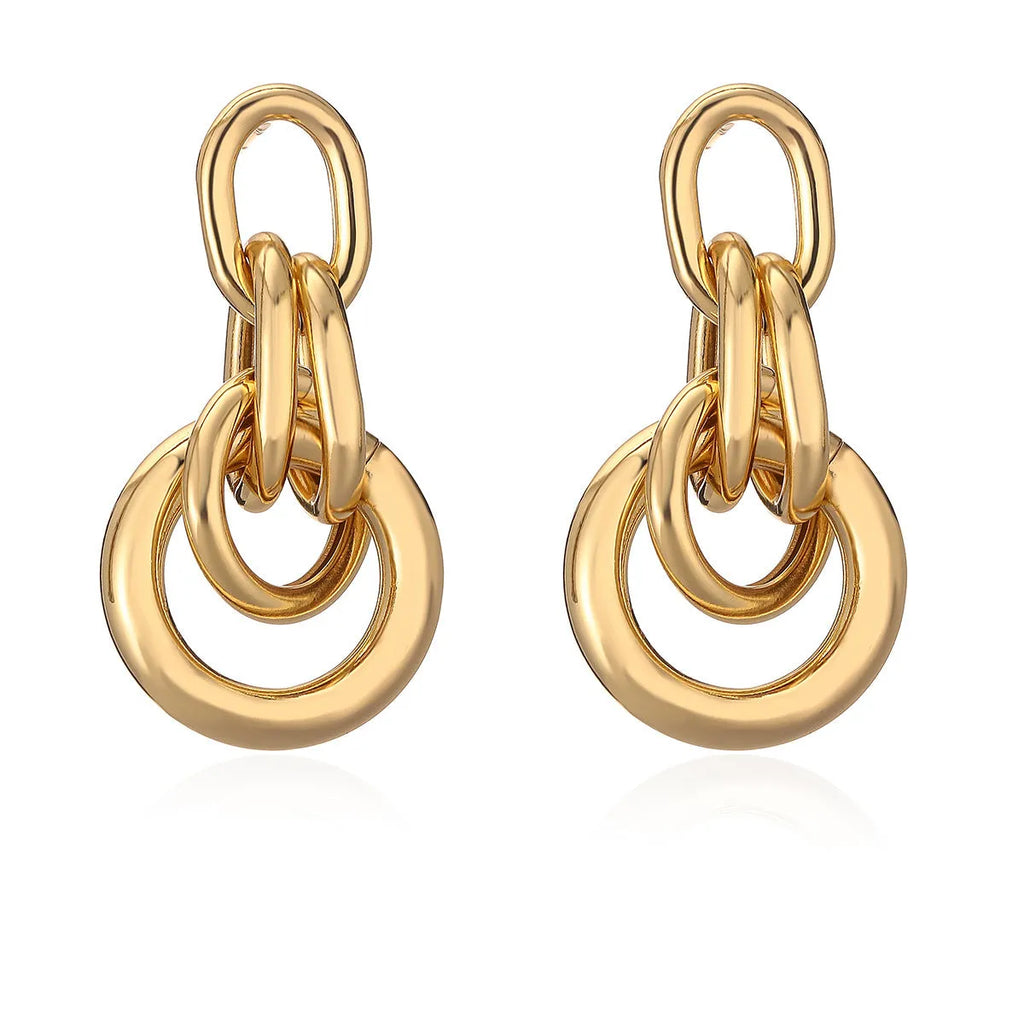 Gold-colour geometric copper earrings for women with an irregular, high-profile silhouette.