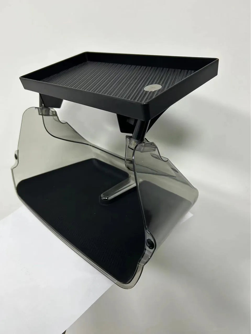 Black ABS storage box placed under Tesla Model 3 centre screen