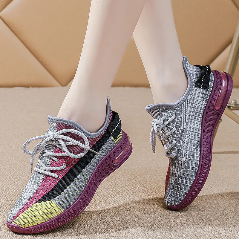 Women's lightweight breathable lace-up running shoes in black with round toe and low top profile