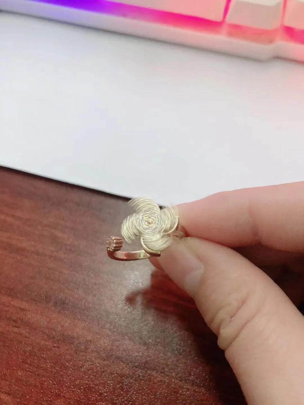 Unisex copper rotating ring with spinning windmill design in gold and silver colours