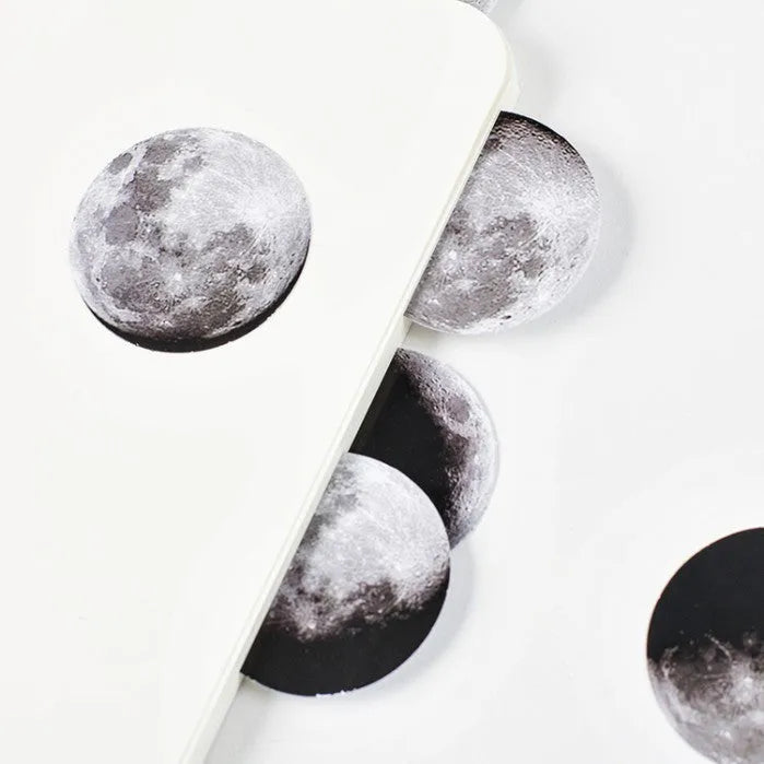 Boxed stickers showing moon phases and calendar planet designs in black on self-adhesive paper, 45 pieces per pack