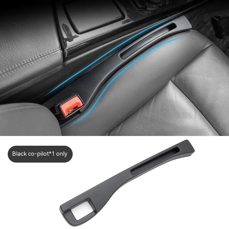 Black car seat gap storage box with handle between vehicle seats