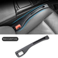 Black car seat gap storage box with handle between vehicle seats