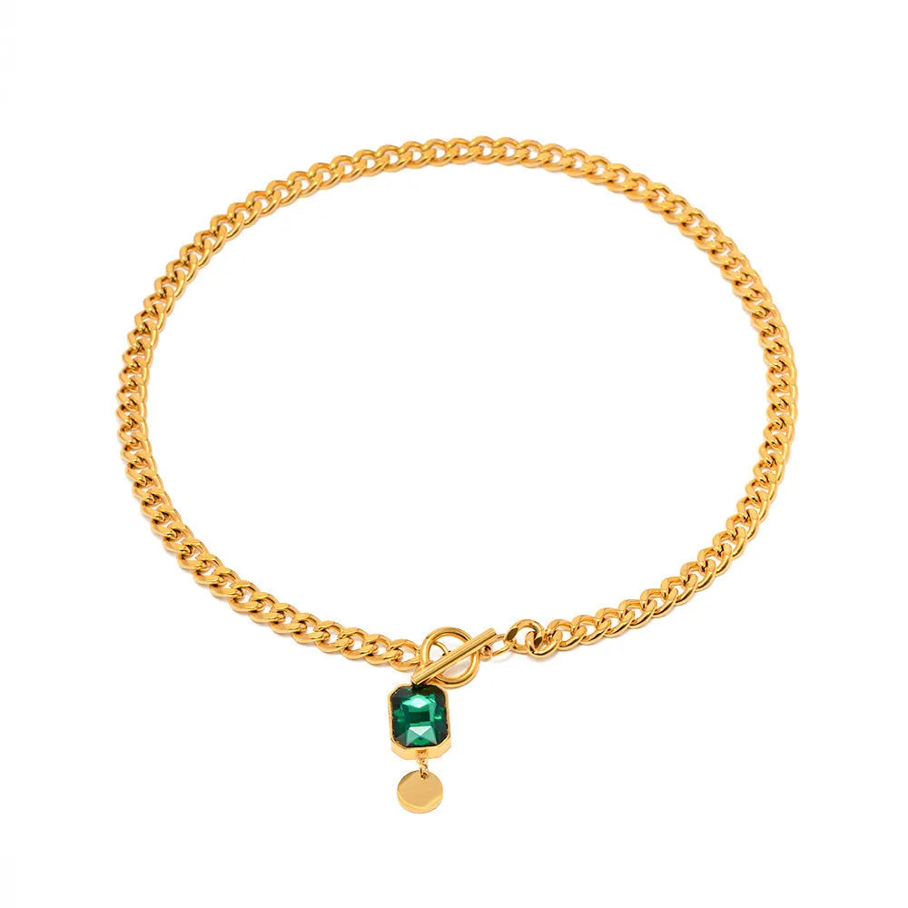 Gold electroplated titanium steel necklace with geometric round emerald zircon pendant on Cuban chain