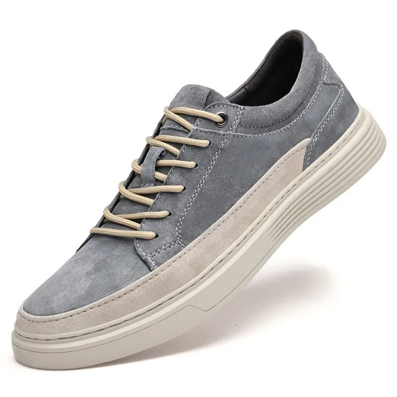 Men's grey casual leather skate shoes with lace-up front and rubber sole