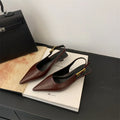 Thin low heel strap pointed leather shoes for women, black colour, side view showing heel height and ankle strap