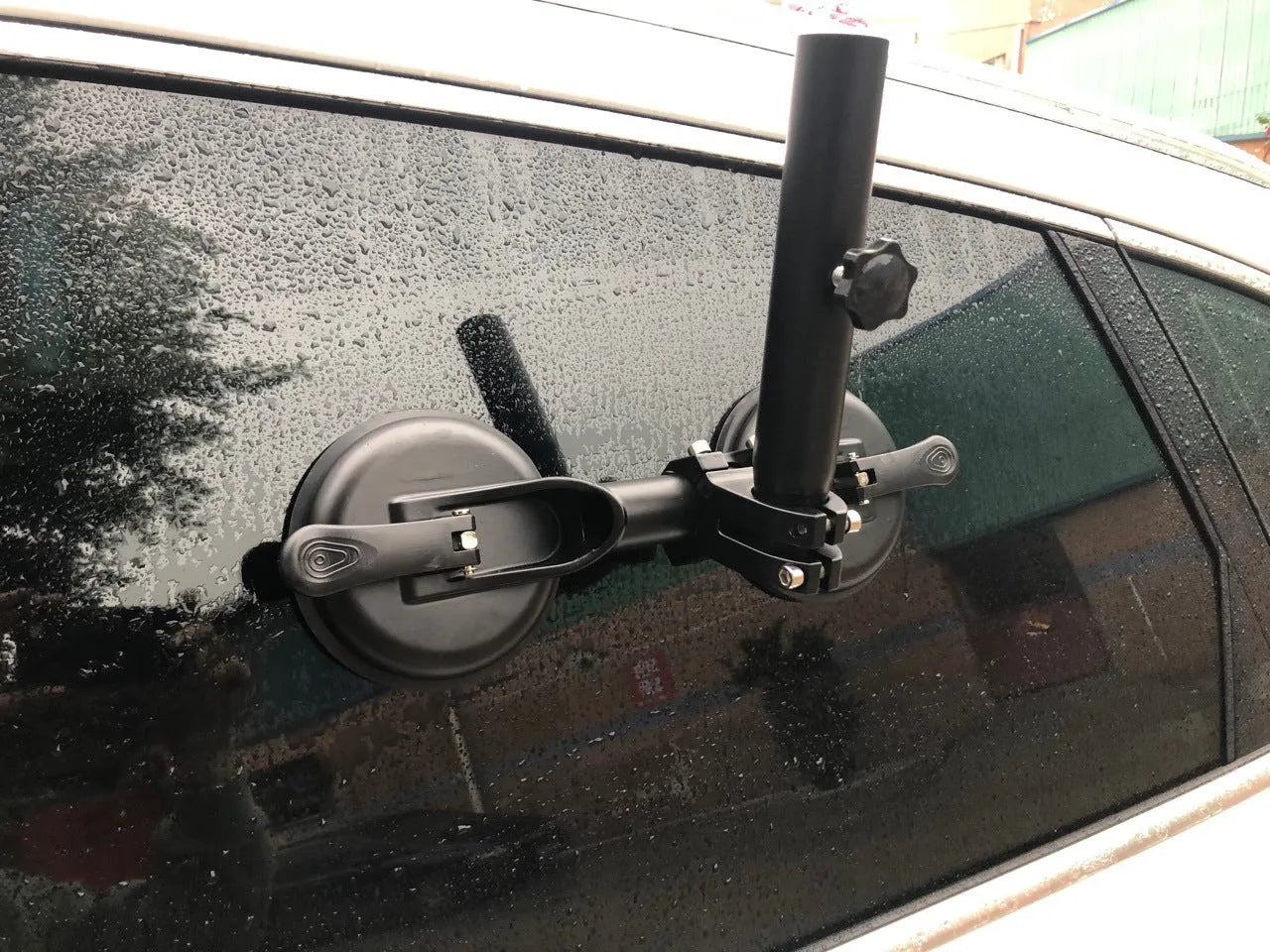 Black off-road car flagpole sucker base with round rubber suction cup and ABS plastic body.