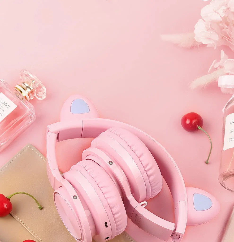 Pink white luminous Bluetooth headset with head-mounted design and protein ear pads