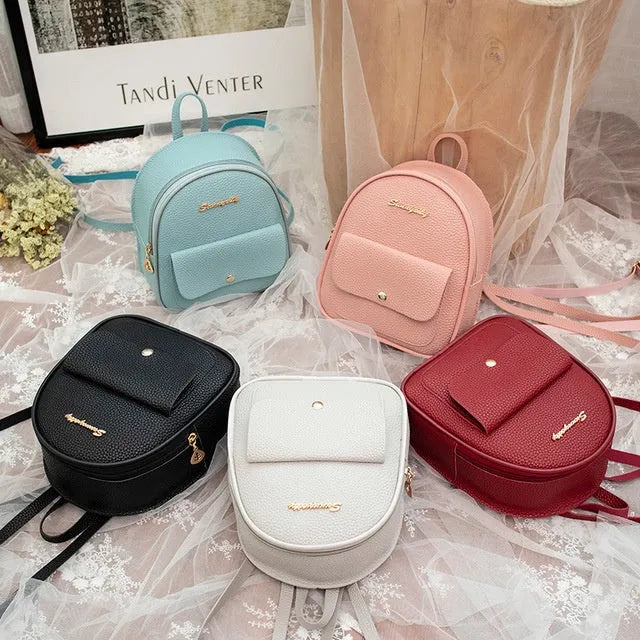 Black PU leather small women's backpack with zipper, shown as a shoulder bag