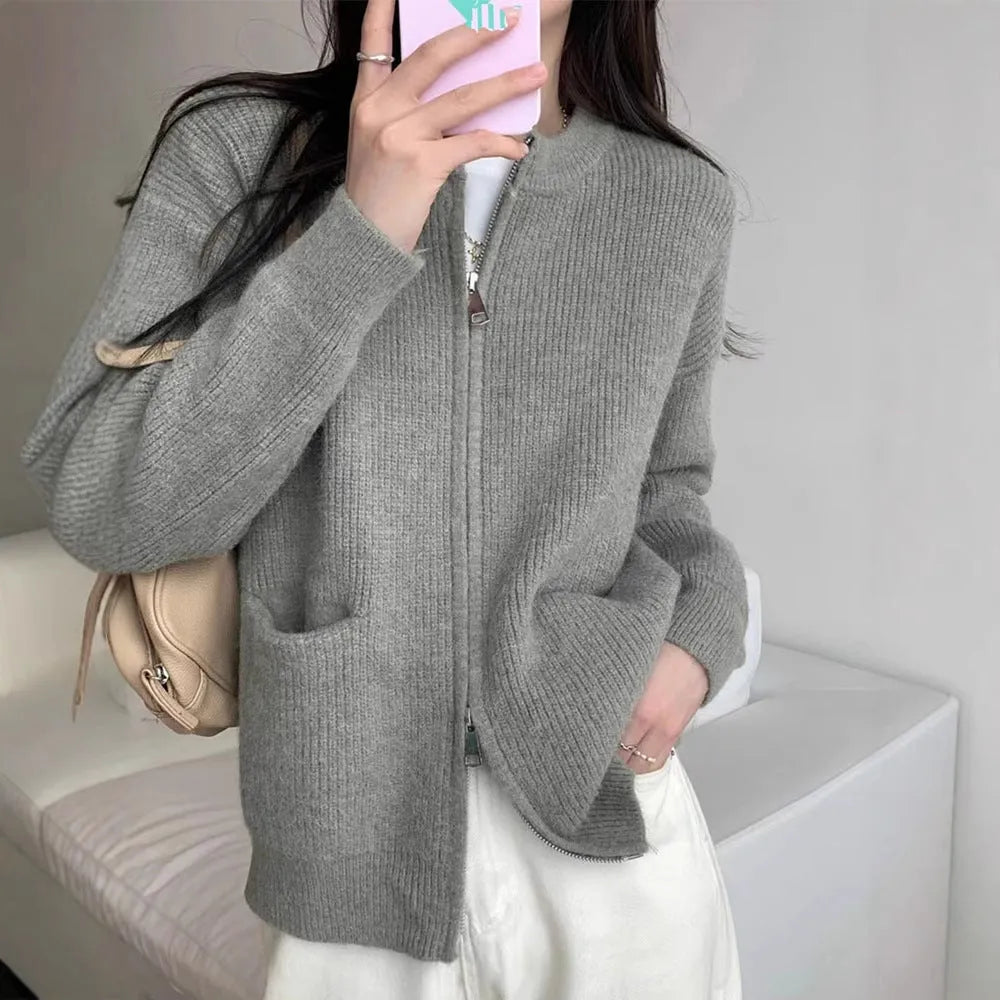 A beige soft glutinous sweater coat cardigan with long sleeves, shown buttoned.
