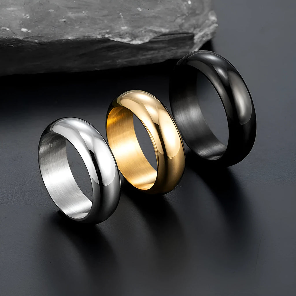 Glossy electroplated titanium steel ring in gold colour on a white background.