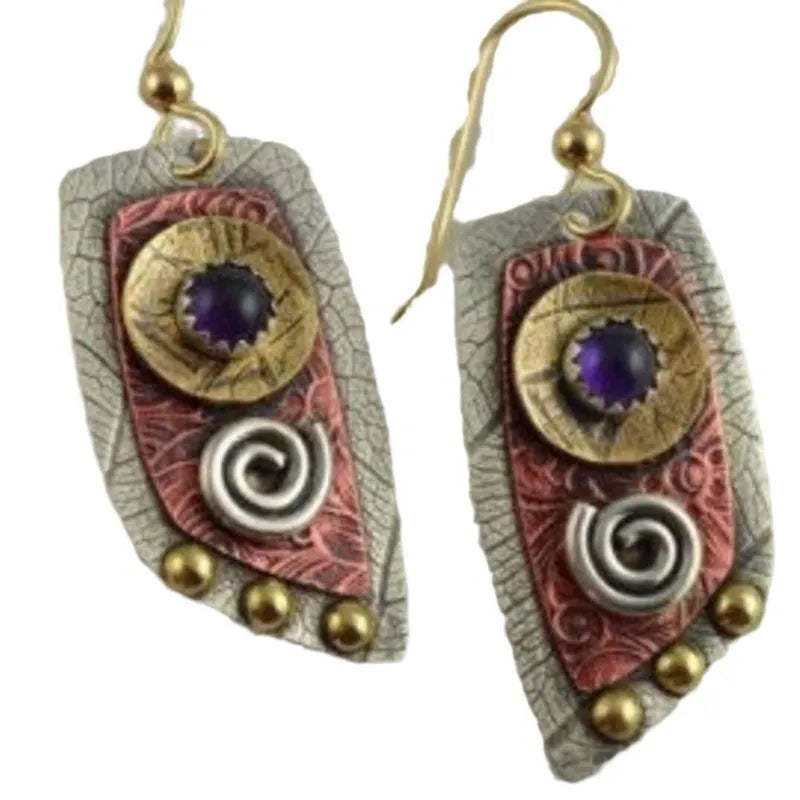Gold tone geometric earrings with camouflage leopard print pattern on irregular stud shapes