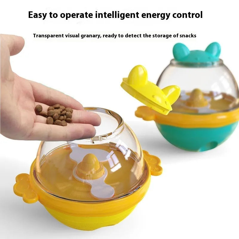 Yellow TPR dog tumbler food feeder toy on a light background, 11.2 cm high