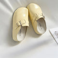 Flat buckle casual sneakers in creamy-white with round toe and PU upper