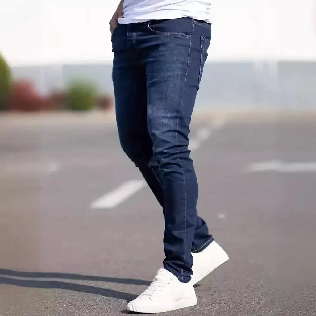 Dark blue men's slim fit skinny jeans with stretch cotton fabric on a mid waist.