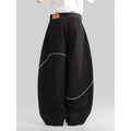 Black straight-leg denim trousers with mid waist and zip placket closure on hanger