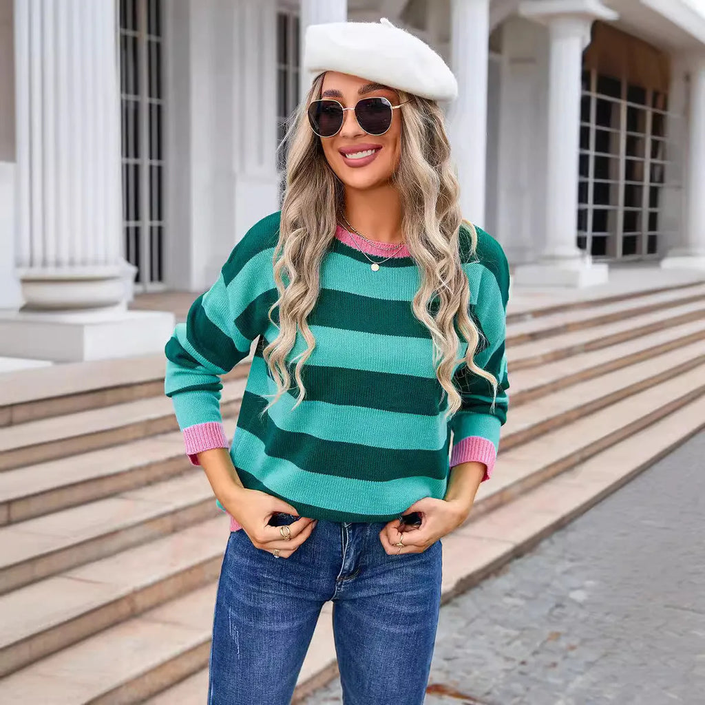 Women's loose fit long sleeve acrylic sweater in a striped pattern, shown in a blue colour.