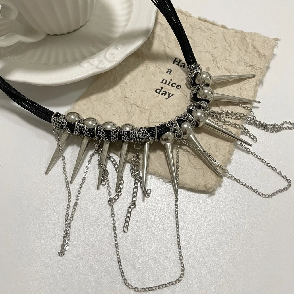 Leather necklace with round beads, winding tassel, and point rivet details in casual style