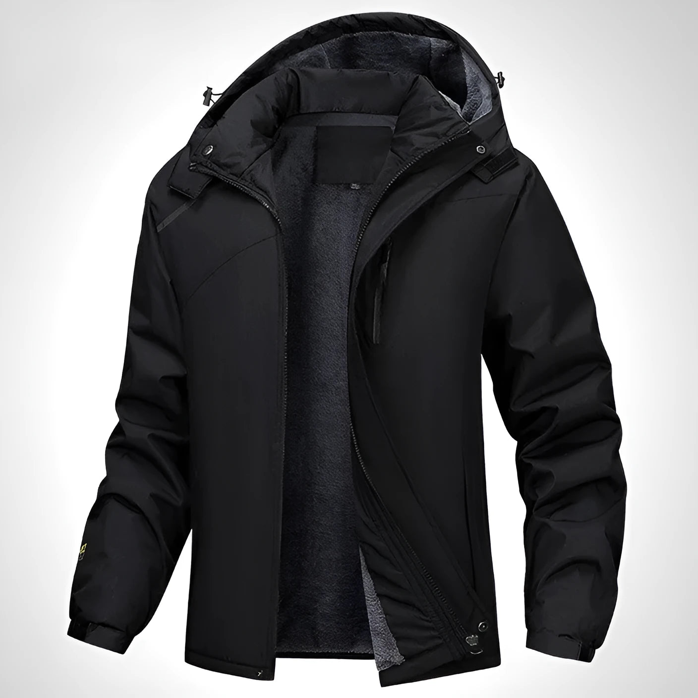 Man wearing a dark grey waterproof hooded plus-size coat outdoors.