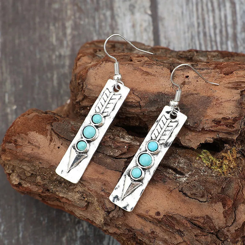Silver geometric long drop earrings with turquoise inlay on a retro-style zinc alloy setting.