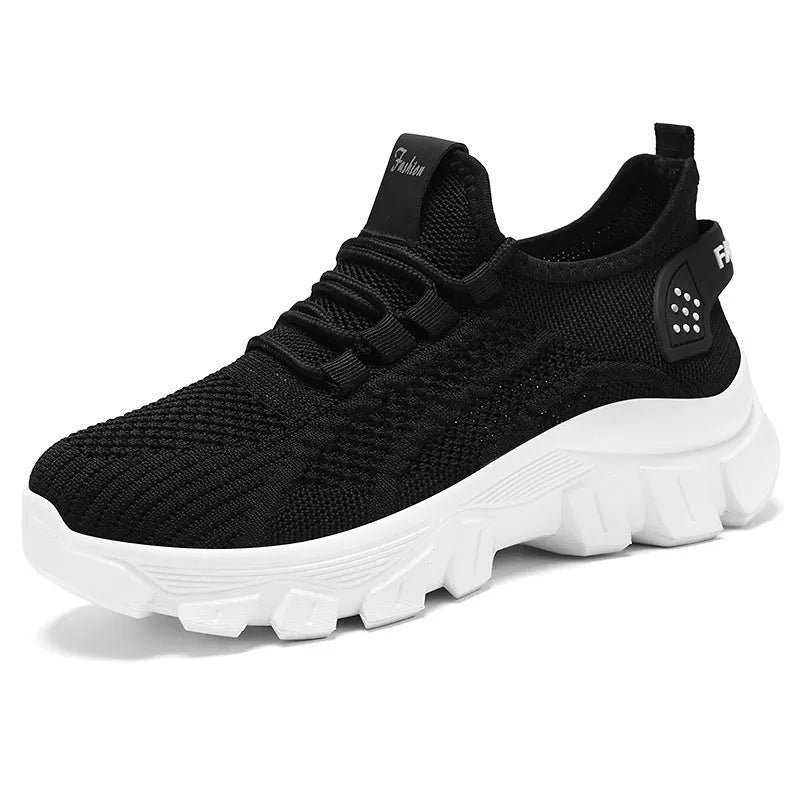 Men's white Flyknit running shoes with thick PVC sole and lace-up front.