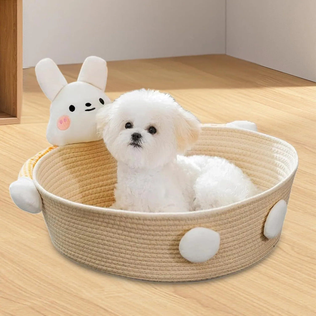 Woven cotton rope cat bed and scratching board basket shown in a home setting.
