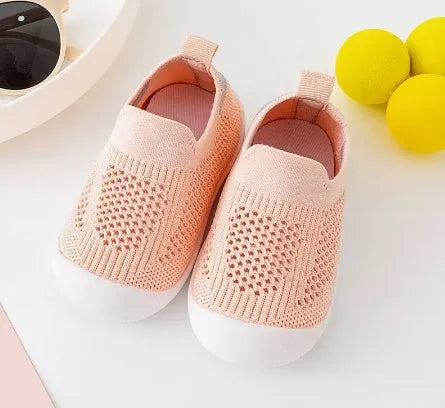 Baby soft sole non-slip walking shoes in cream yellow with fly woven cotton upper and natural rubber sole