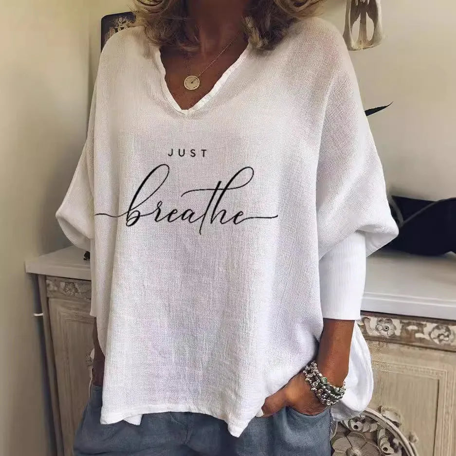 Women's loose V-neck top in brushed milk silk with digital print pattern on a white background