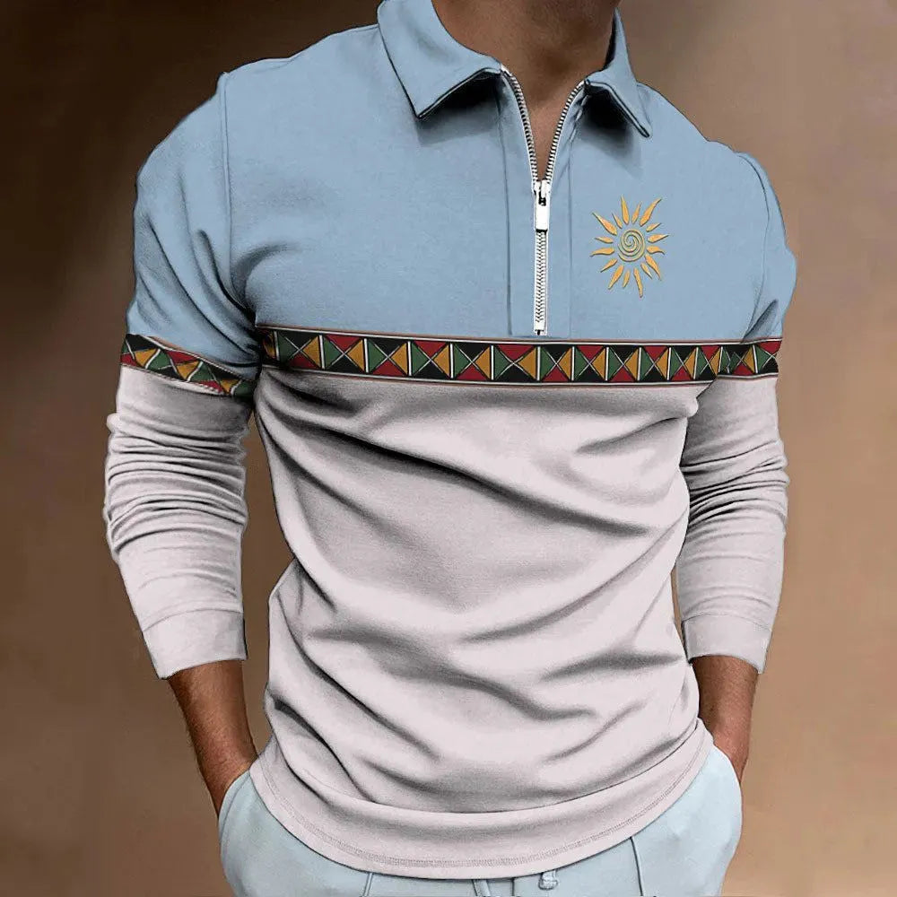 Man wearing a loose-fit long sleeve t-shirt with retro colour block printing and a decorative zipper detail.