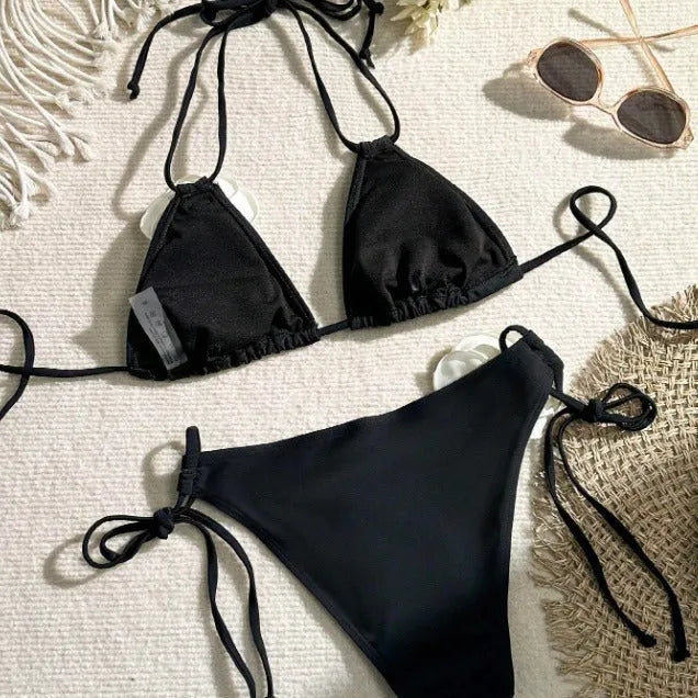 Black 3D flower lace drawstring bikini swimsuit with backless top and shorts on a model