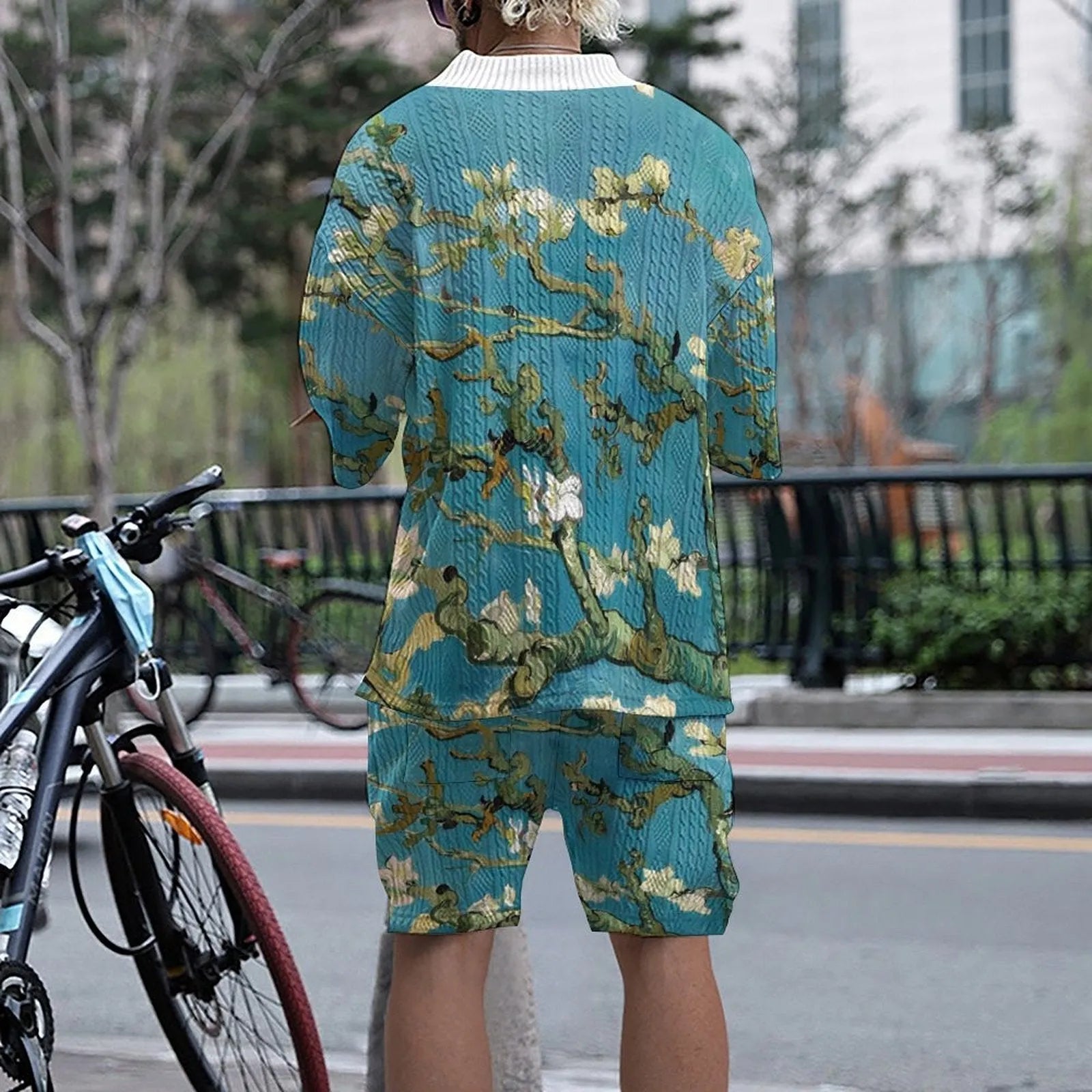Men's peacock blue 3D printed knitted shorts suit with matching t-shirt, laid flat.