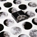 Boxed stickers showing moon phases and calendar planet designs in black on self-adhesive paper, 45 pieces per pack