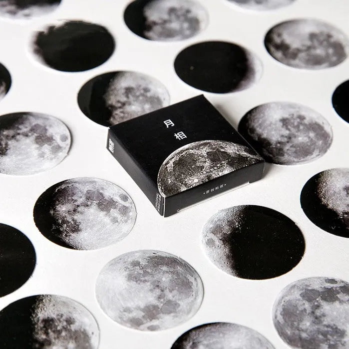 Boxed stickers showing moon phases and calendar planet designs in black on self-adhesive paper, 45 pieces per pack