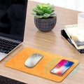 Brown leather wireless charging mouse pad with Qi fast charge capability for computer desks