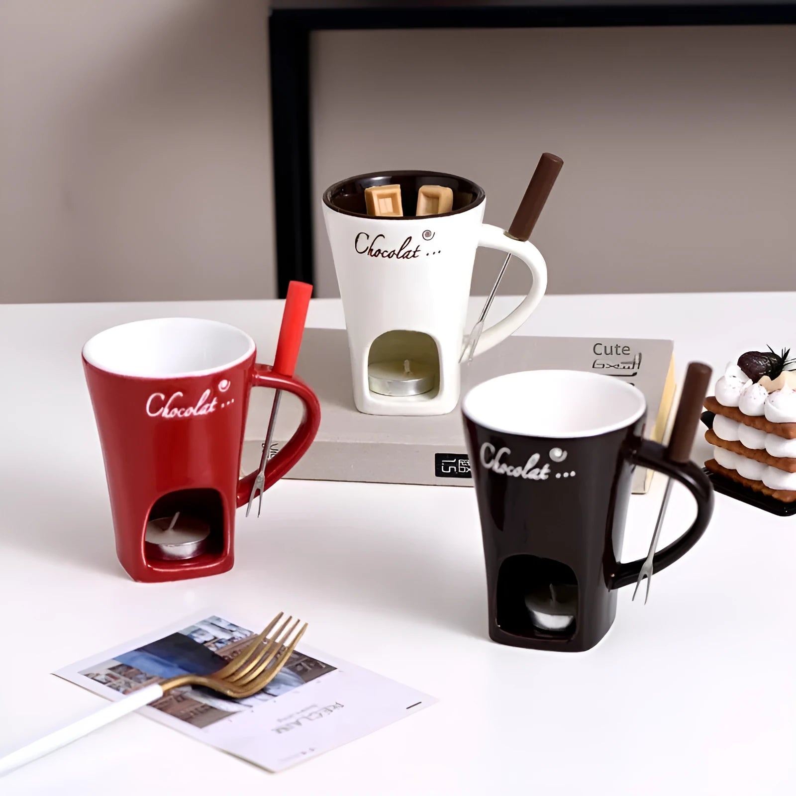 Ceramic binaural hot pot cup in brown for melting chocolate with fork and candle beside it