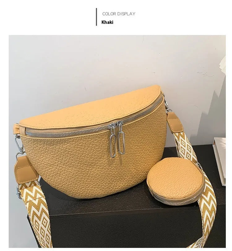 Solid colour PU crossbody bag with saddle lock zipper and sewing thread detail, beige colour, front view
