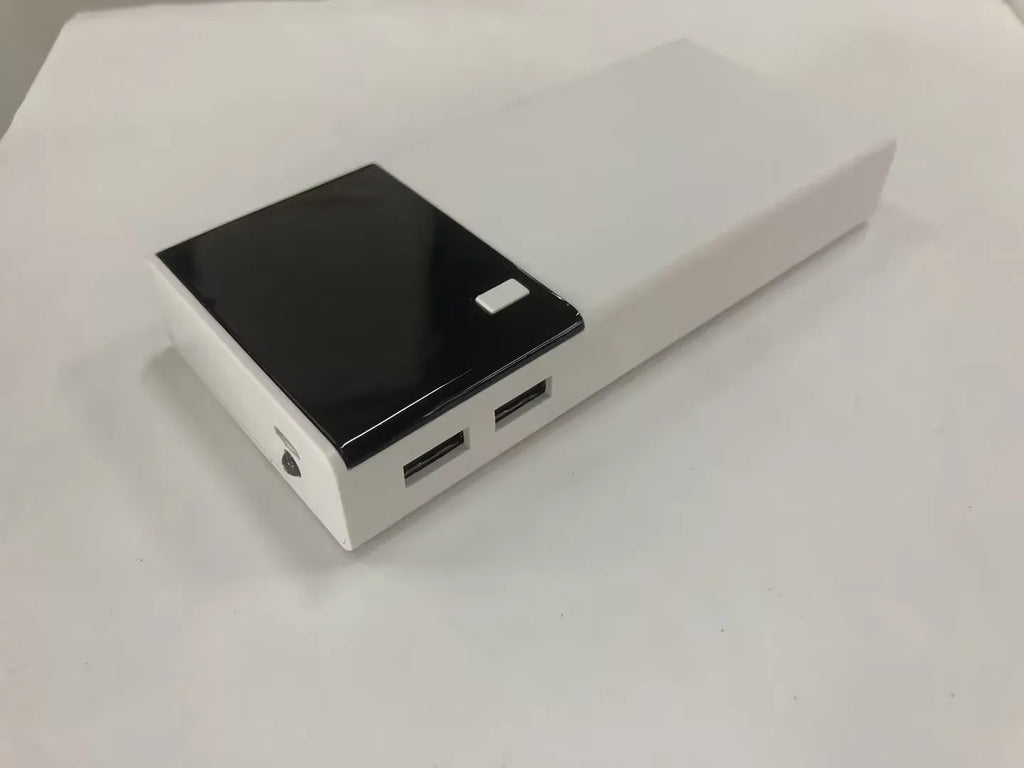 Black 20000mAh portable power bank with USB charging cable, showing compact size.