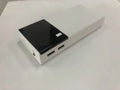 Black 20000mAh portable power bank with USB charging cable, showing compact size.