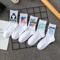 White cotton tube socks with graffiti pattern and middle calf length on plain background