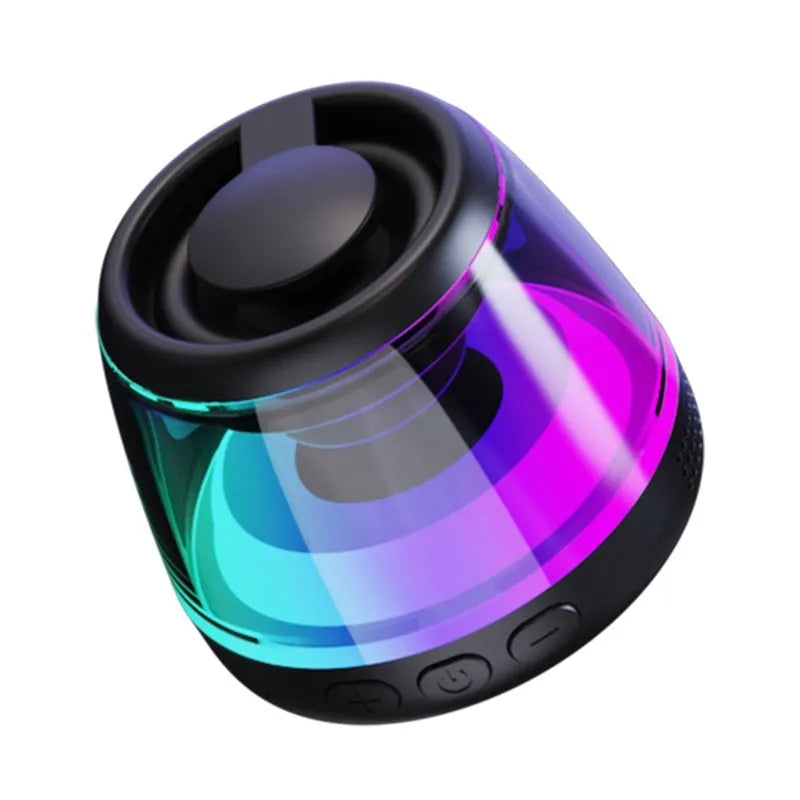 White portable Bluetooth speaker with LED ambience light and magnetic mini design on a desktop