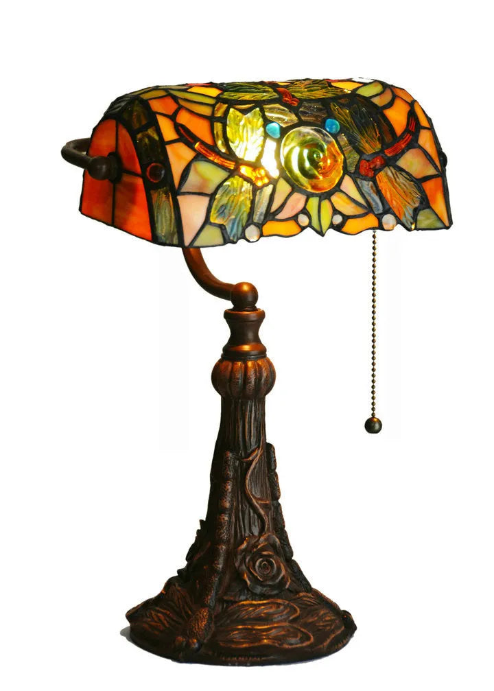 Tiffany table lamp with stained glass shade on resin base, 25cm wide by 36cm tall