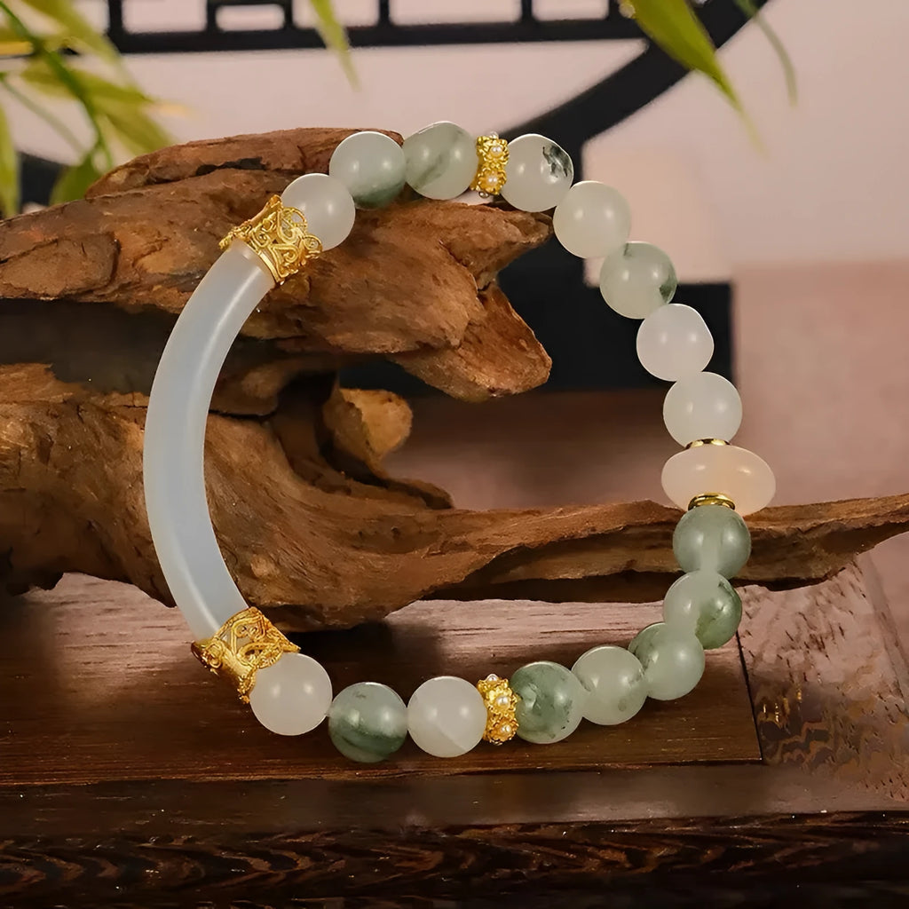 Light green emerald Tian Shan Cui half bracelet with floating flower girl motif on white background