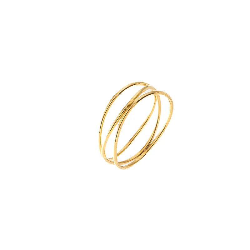 Gold geometric titanium steel ring with a three-layer coil design on a hand.