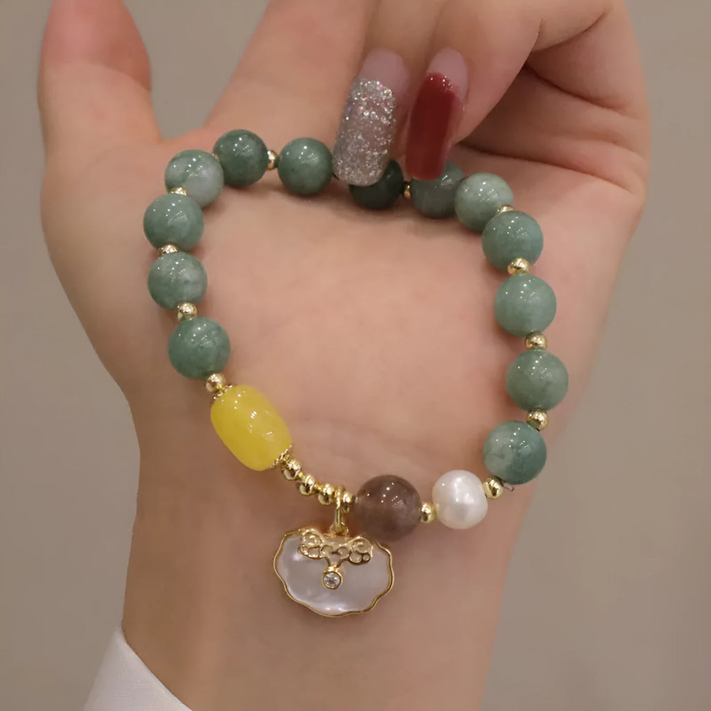 Natural green jade shell bracelet on a woman's wrist, casual style